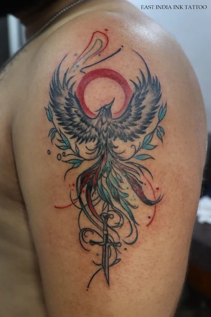 Vibrant firebird phoenix mythological back tattoo