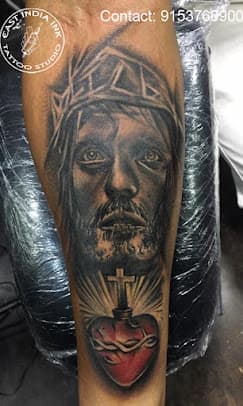 Devotional sacred heart and thorns forearm realism tattoo