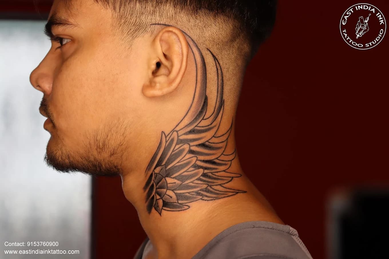 Feathered angelic wing neck anatomical flow tattoo